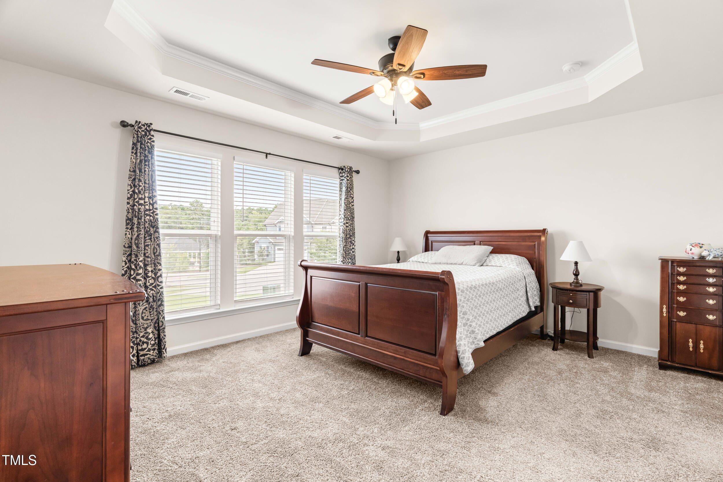 113 Lafferty Street Durham, NC 27703 - Photo 20 of 39 a bed sitting in a room next to a window