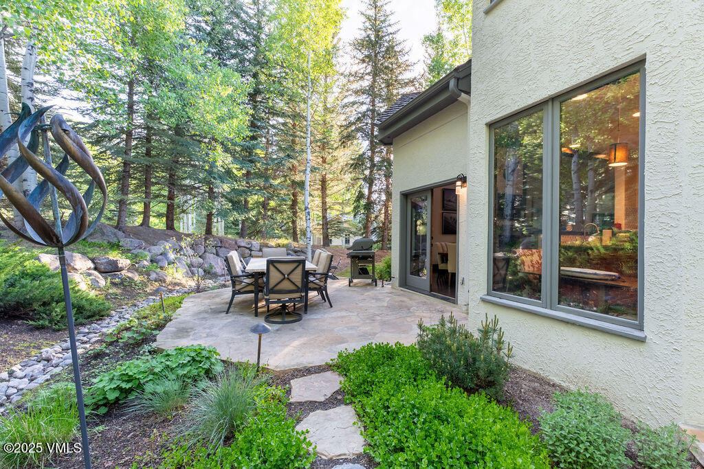 4 Ambleside Place Edwards, CO 81632 - Photo 12 of 22 a view of a backyard with sitting area and garden