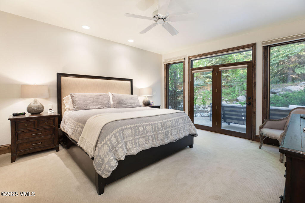 4 Ambleside Place Edwards, CO 81632 - Photo 14 of 22 a spacious bedroom with a bed and large mirror