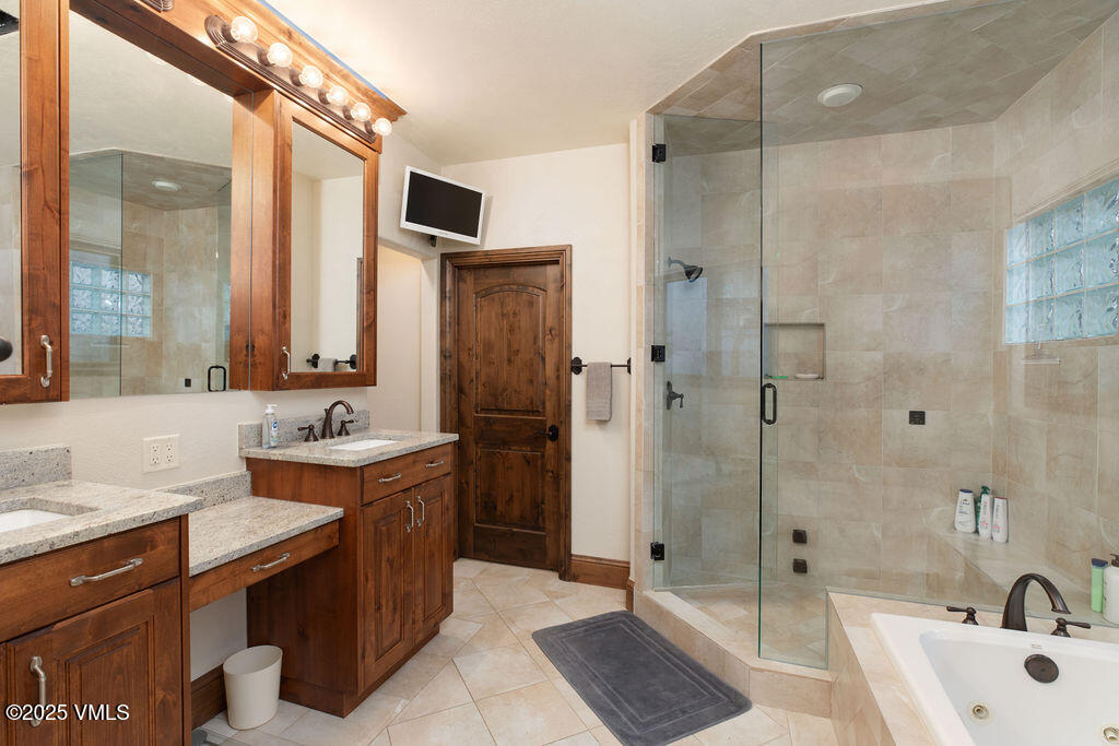4 Ambleside Place Edwards, CO 81632 - Photo 15 of 22 a bathroom with a sink double vanity and shower