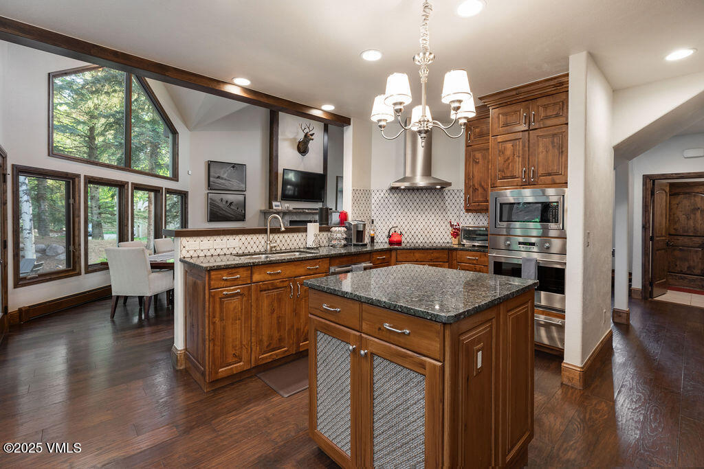 4 Ambleside Place Edwards, CO 81632 - Photo 16 of 22 a kitchen with granite countertop cabinets a sink a counter space and stainless steel appliances