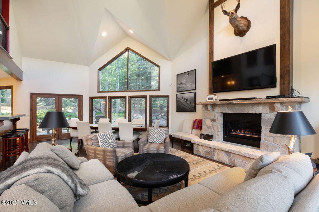 4 Ambleside Place Edwards, CO 81632 - Photo 3 of 22 a living room with furniture a flat screen tv and a fireplace