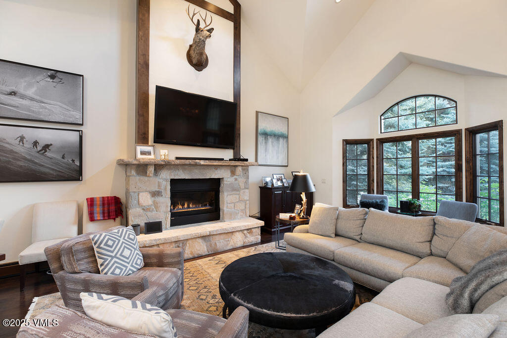 4 Ambleside Place Edwards, CO 81632 - Photo 4 of 22 a living room with furniture a flat screen tv and a fireplace