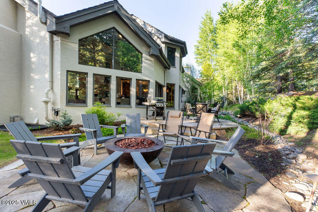 4 Ambleside Place Edwards, CO 81632 - Photo 7 of 22 a view of a patio with table and chairs and potted plants