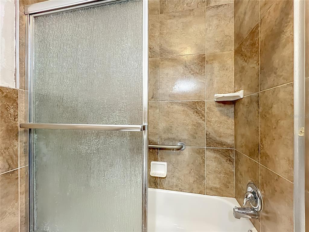 1401 Orange Tree Drive Edgewater, FL 32132 - Photo 28 of 46 a bathroom with a shower