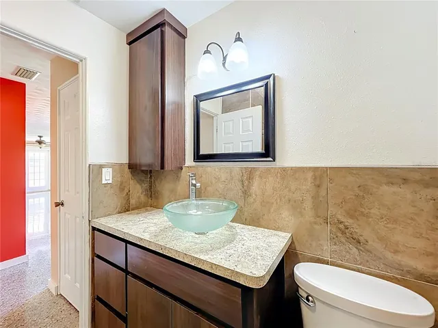 a living room with a couch and a stove next to a window