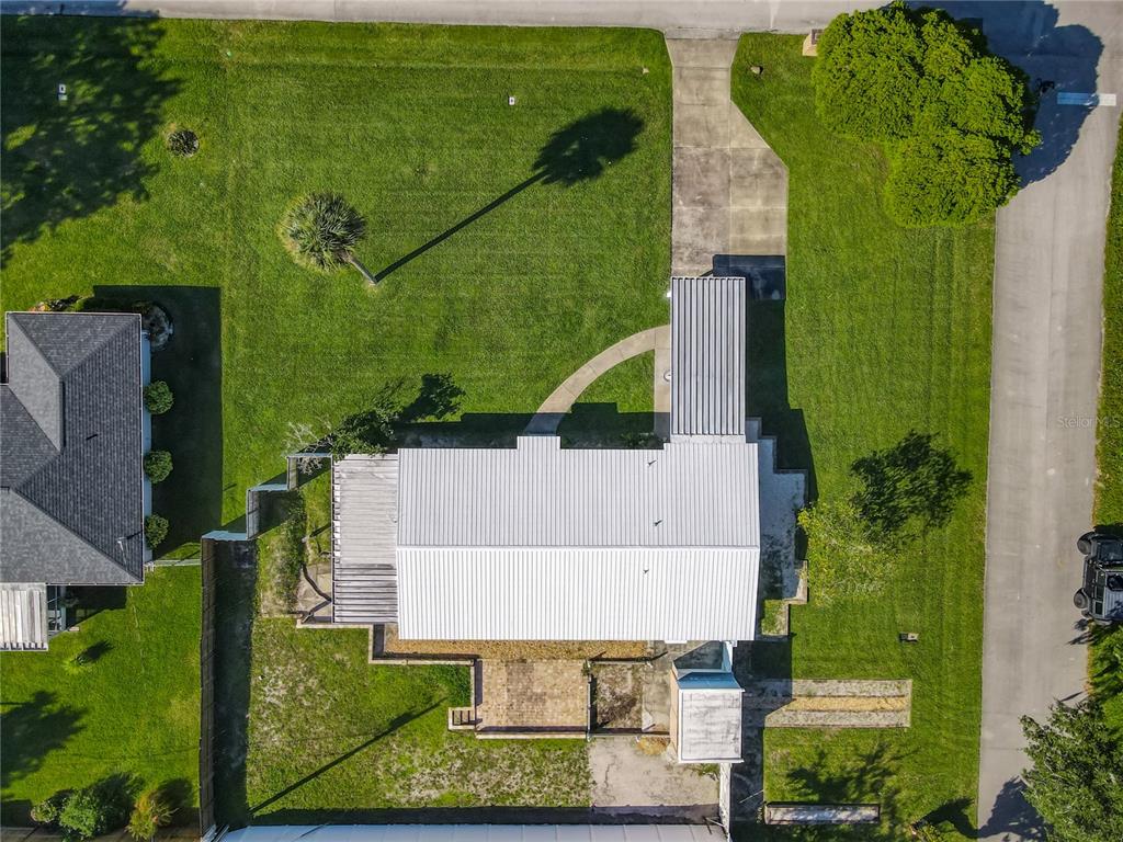 1401 Orange Tree Drive Edgewater, FL 32132 - Photo 35 of 46 an aerial view of a house with a garden