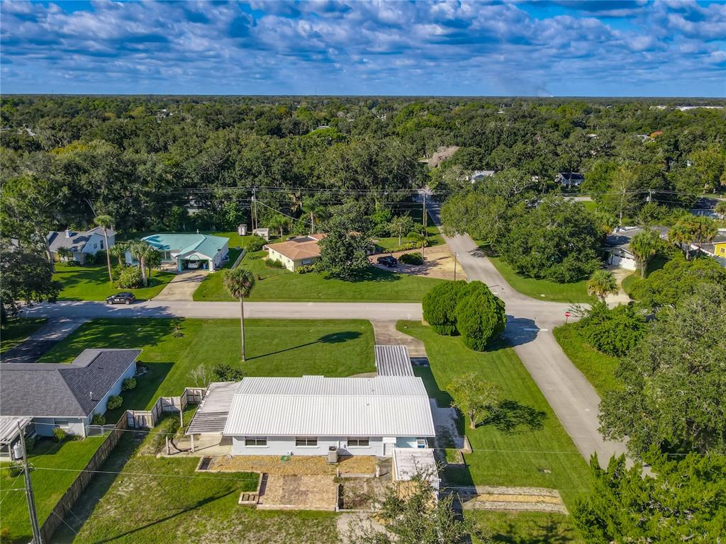 1401 Orange Tree Drive Edgewater, FL 32132 - Photo 38 of 46 an aerial view of a house with a yard