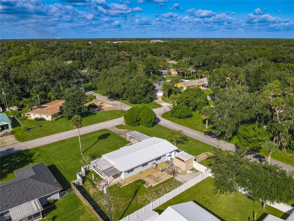 1401 Orange Tree Drive Edgewater, FL 32132 - Photo 39 of 46 a view of a yard with an outdoor space