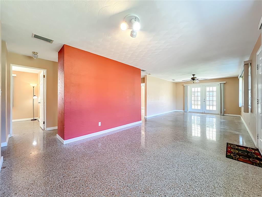 1401 Orange Tree Drive Edgewater, FL 32132 - Photo 6 of 46 a view of a livingroom with furniture wooden floor and a window