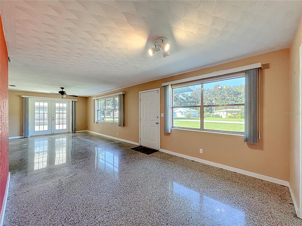 1401 Orange Tree Drive Edgewater, FL 32132 - Photo 7 of 46 wooden floor in an empty room with a window