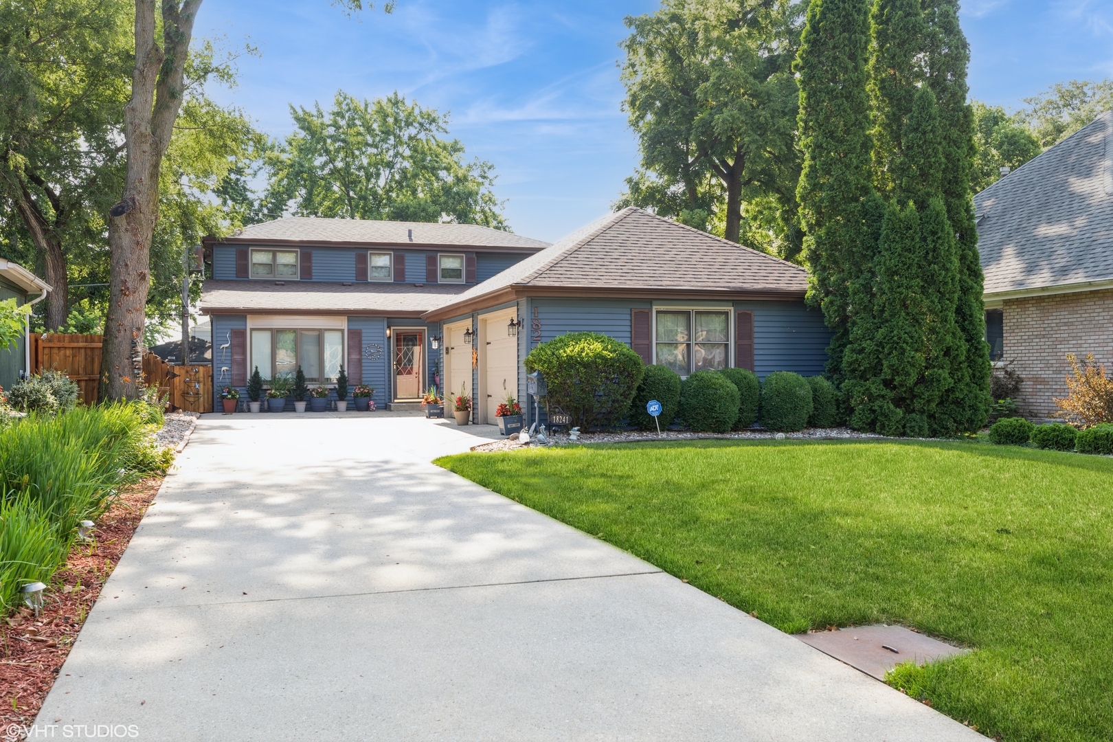 a front view of a house with garden