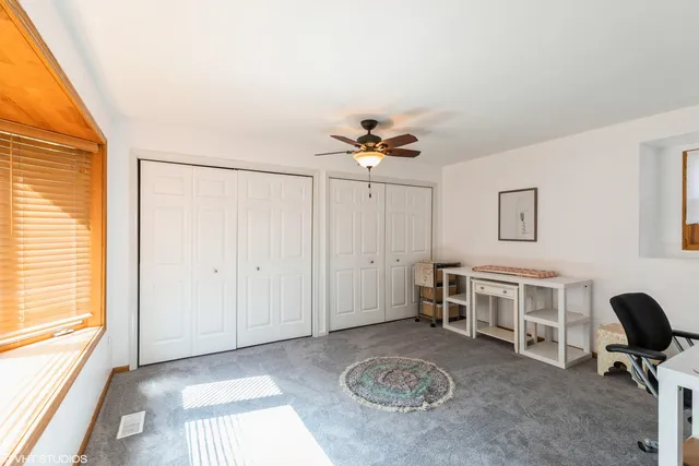a view of a livingroom with furniture and a window