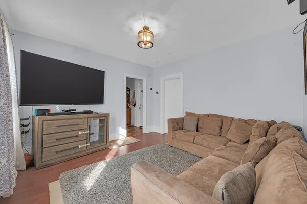 a large kitchen with stainless steel appliances granite countertop a refrigerator and a stove top oven