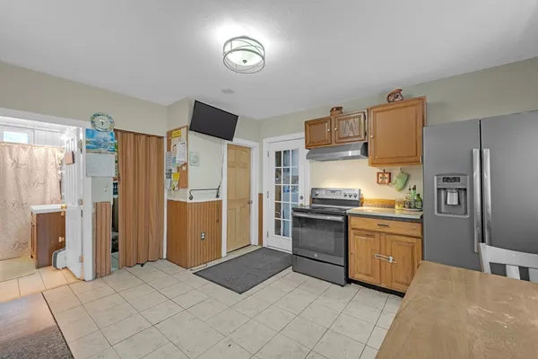 a kitchen with stainless steel appliances granite countertop a stove and a sink