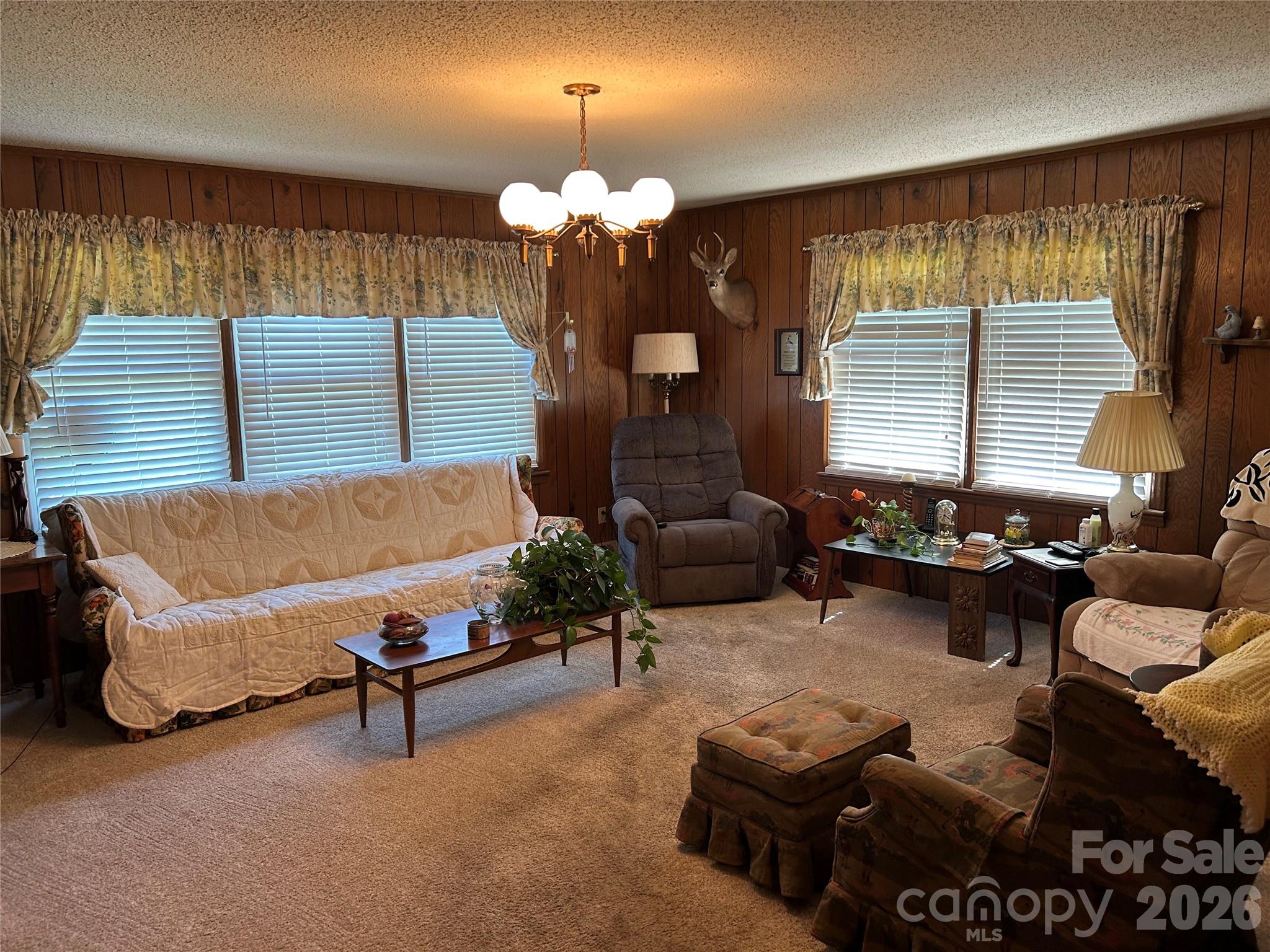 336 Bridges Road Blacksburg, SC 29702 - Photo 9 of 26 a living room with furniture chandelier and a fireplace