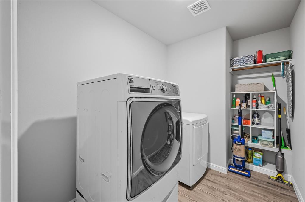 977 Sam Street Springtown, TX 76082 - Photo 15 of 29 a utility room with dryer and washer
