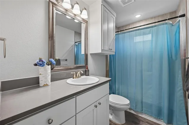 a bedroom with a bed a desk and chair