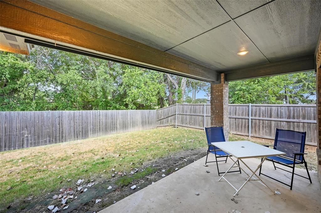 977 Sam Street Springtown, TX 76082 - Photo 24 of 29 a garden view with a seating space