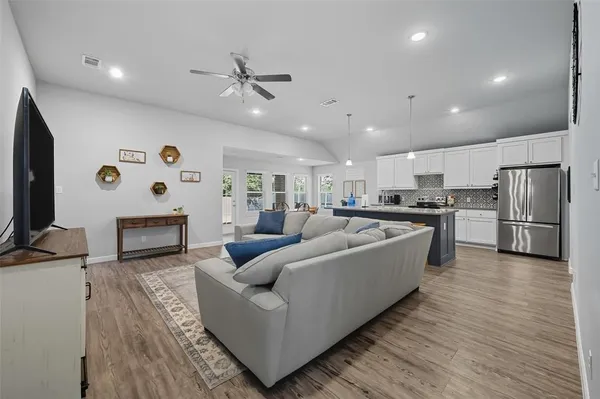a living room with furniture and a flat screen tv