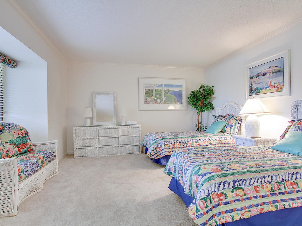 1880 Bay Road, Unit 220I Vero Beach, FL 32963 - Photo 18 of 35 a bedroom with a bed and a window