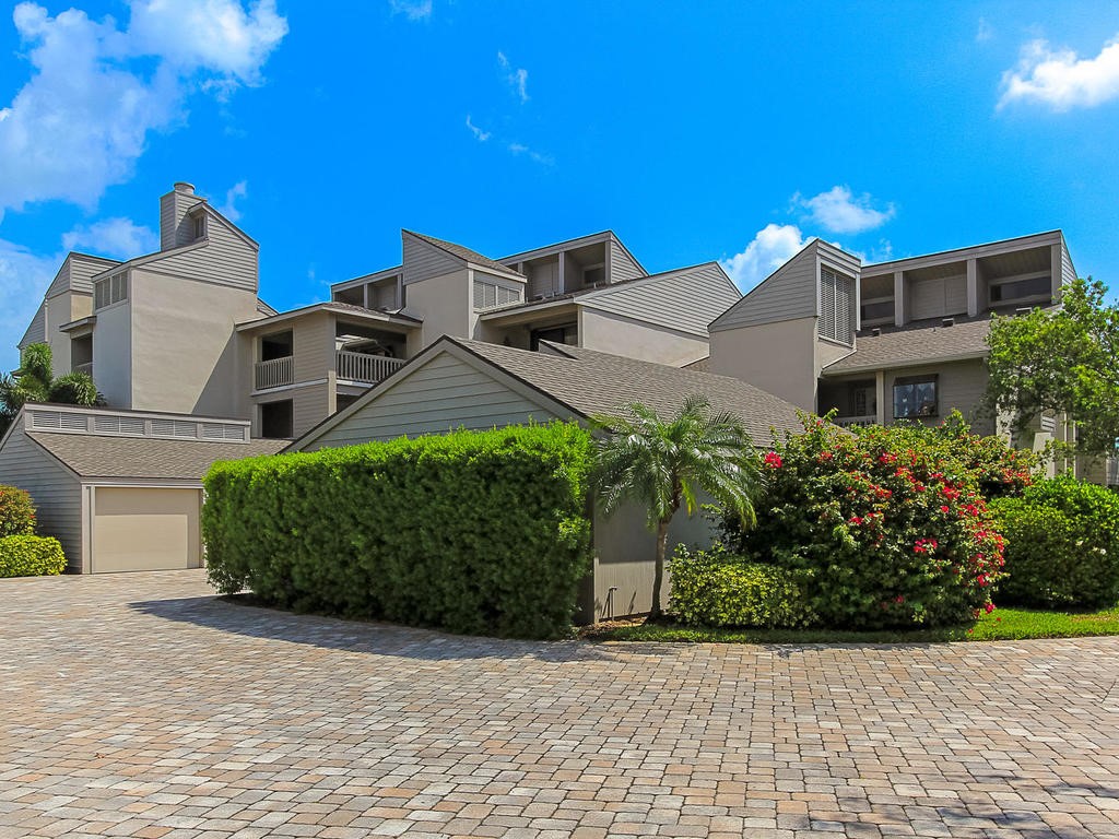 1880 Bay Road, Unit 220I Vero Beach, FL 32963 - Photo 24 of 35 a front view of a house with a garden