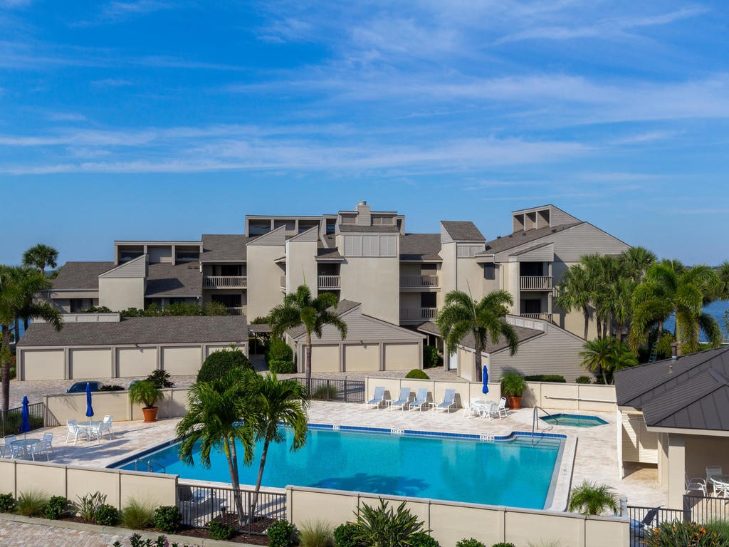1880 Bay Road, Unit 220I Vero Beach, FL 32963 - Photo 25 of 35 a view of a house with outdoor space and sitting area