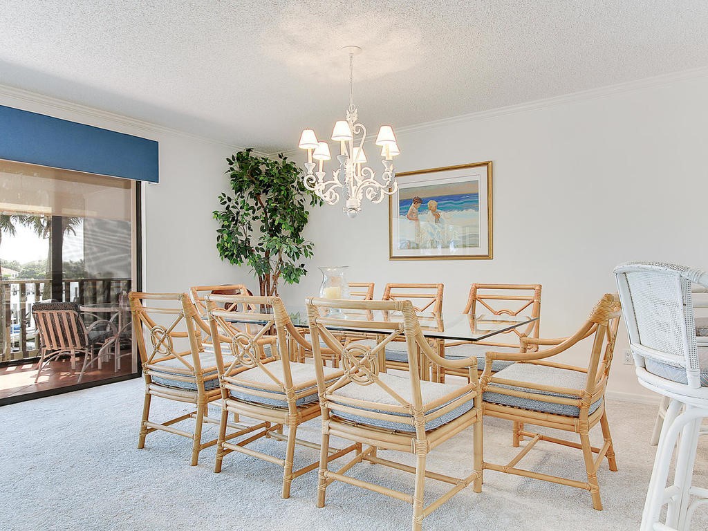 1880 Bay Road, Unit 220I Vero Beach, FL 32963 - Photo 10 of 35 a view of a dining room with furniture and chandelier