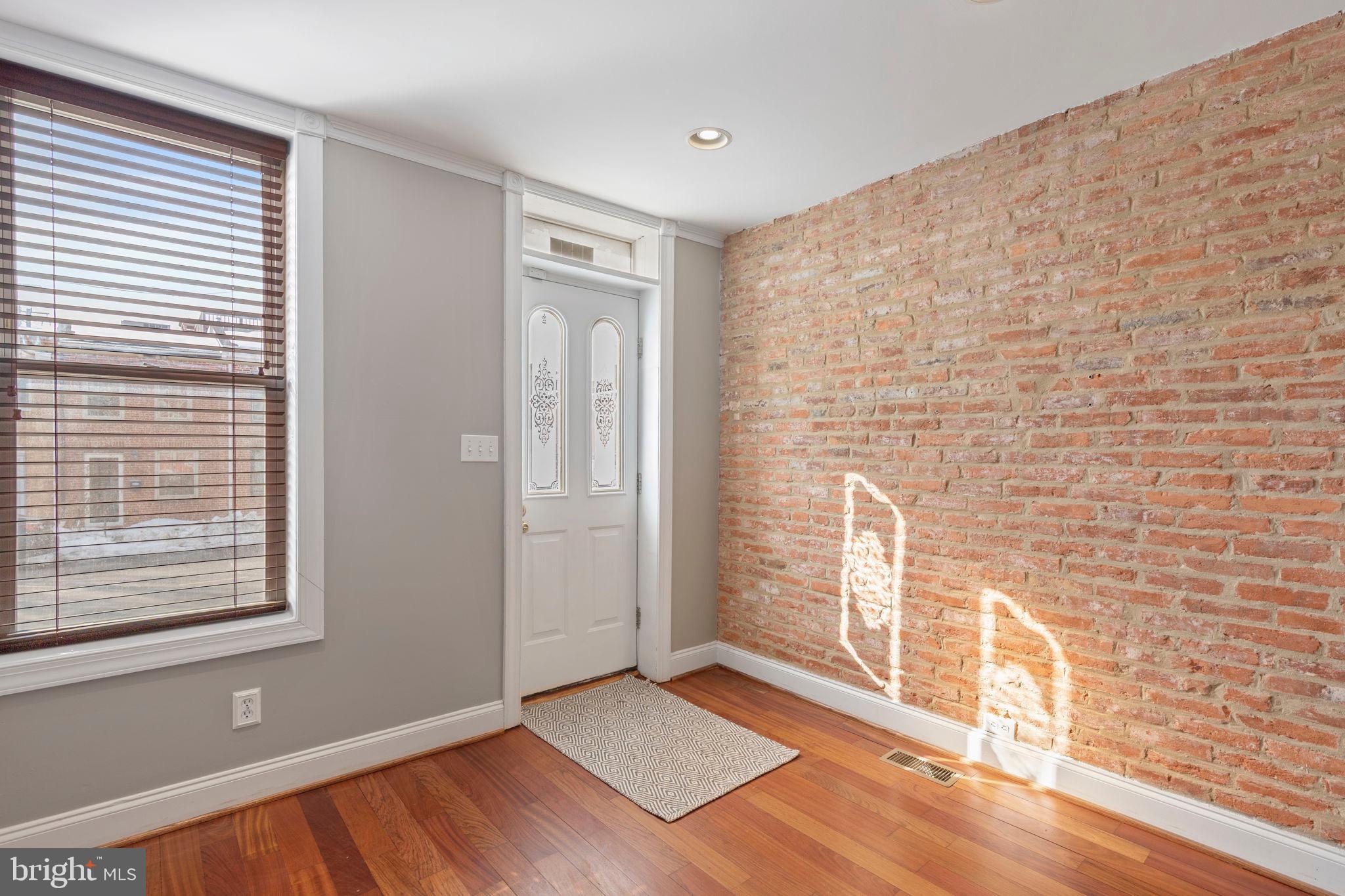 2428 Fleet Street Baltimore, MD 21224 - Photo 5 of 24 a view of an empty room and window