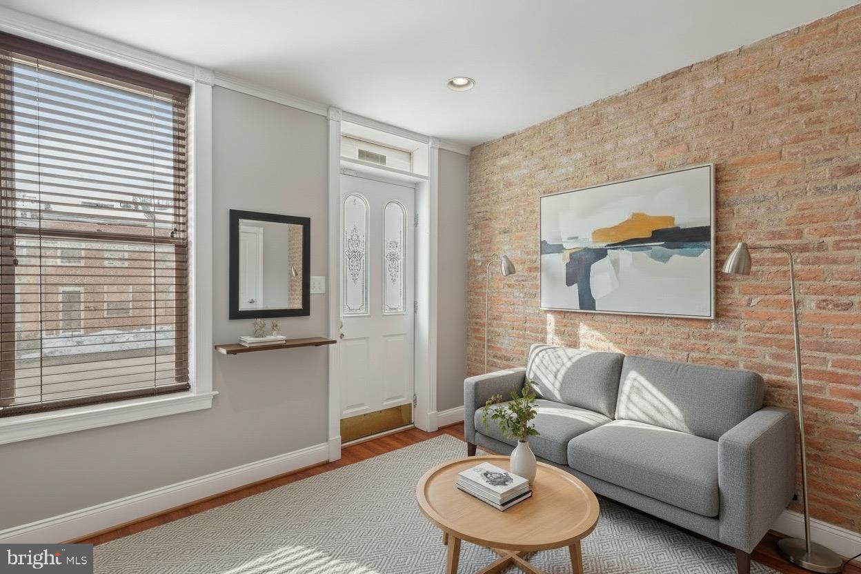2428 Fleet Street Baltimore, MD 21224 - Photo 6 of 24 a living room with furniture and a window