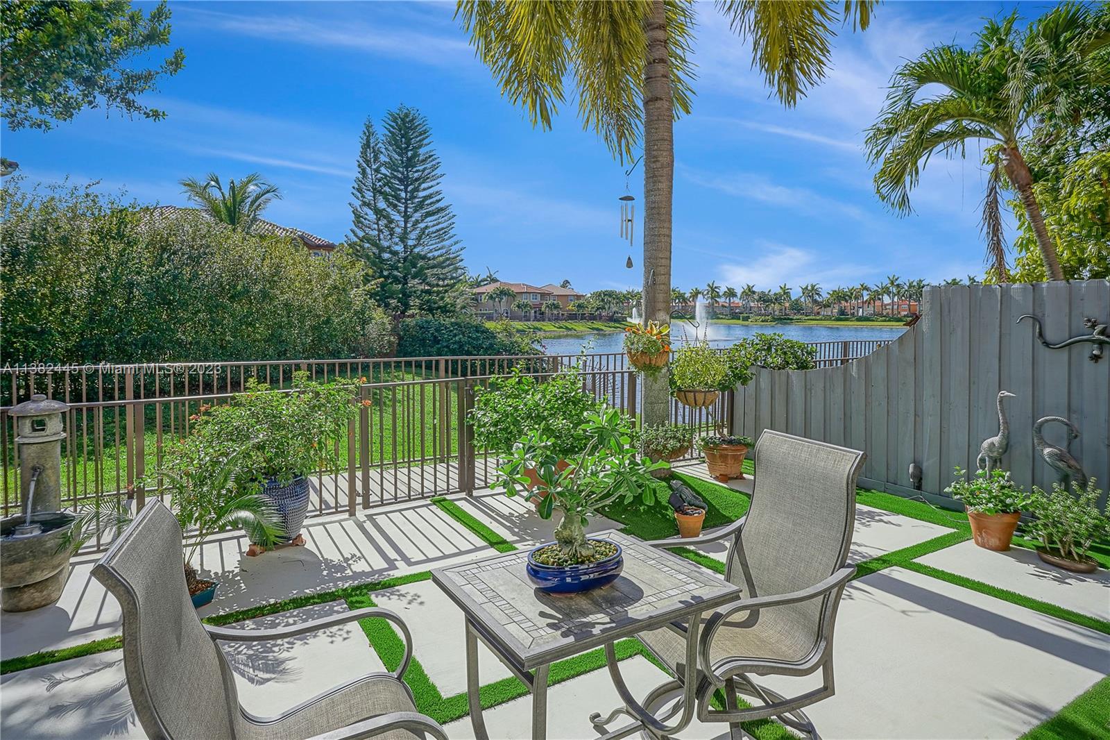 a view of a chair and tables on the patio