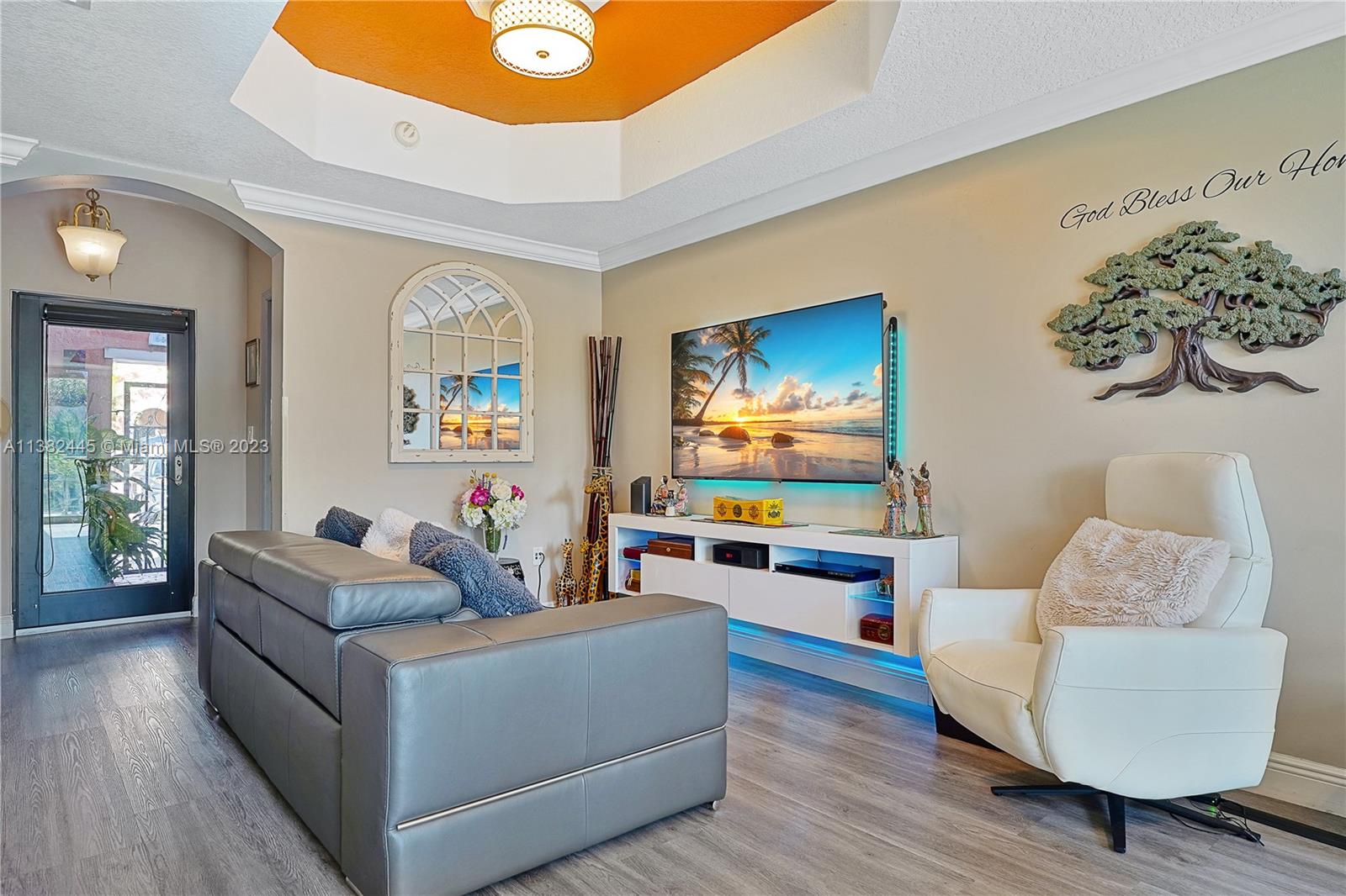 3078 Southwest 153rd Path, Unit 3078 Miami, FL 33185 - Photo 11 of 36 a living room with furniture and a flat screen tv