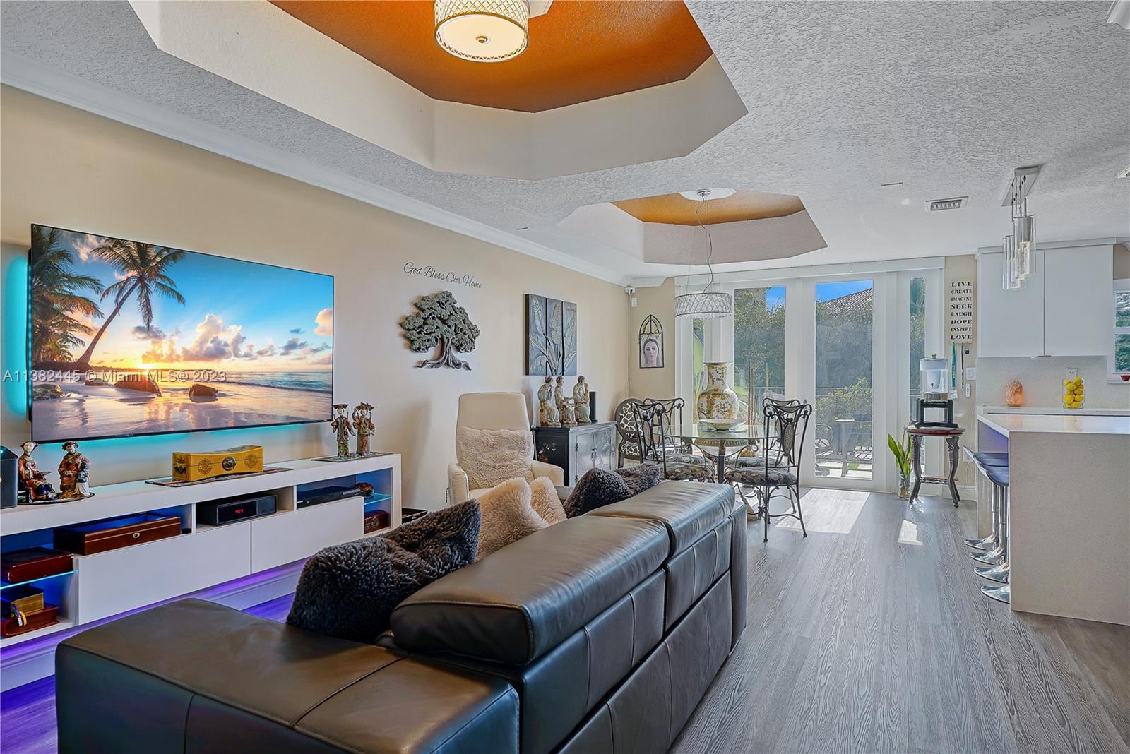 3078 Southwest 153rd Path, Unit 3078 Miami, FL 33185 - Photo 12 of 36 a living room with furniture and a flat screen tv