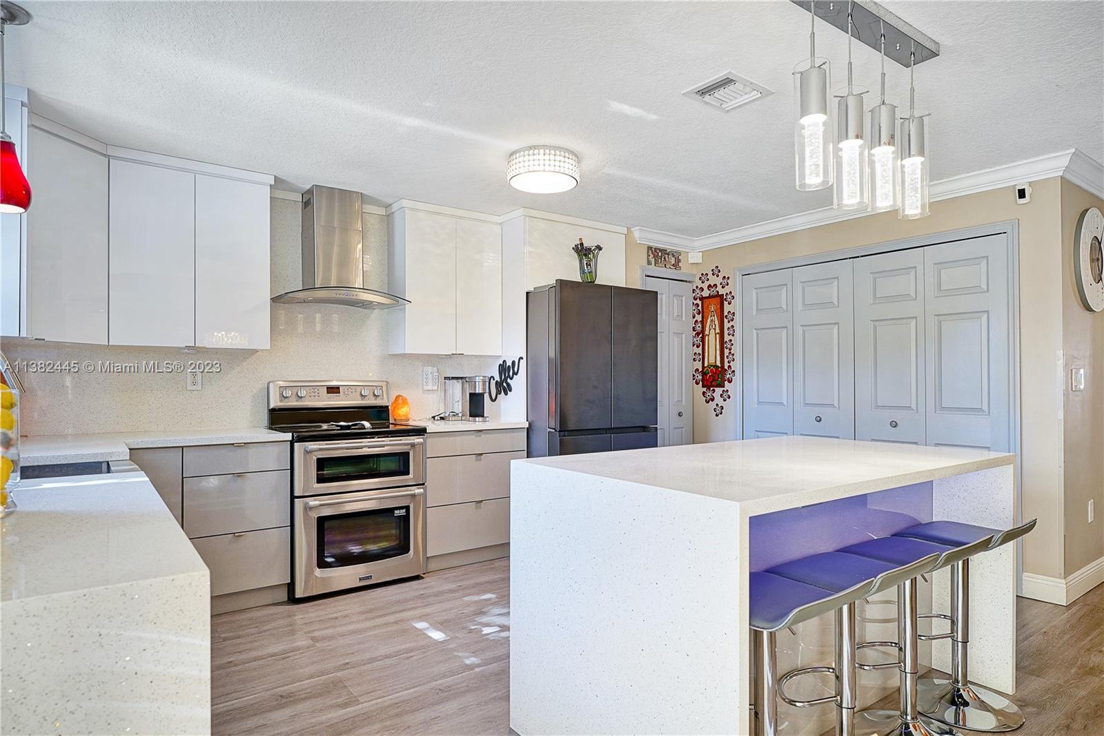 3078 Southwest 153rd Path, Unit 3078 Miami, FL 33185 - Photo 15 of 36 a kitchen with stainless steel appliances a refrigerator sink and stove
