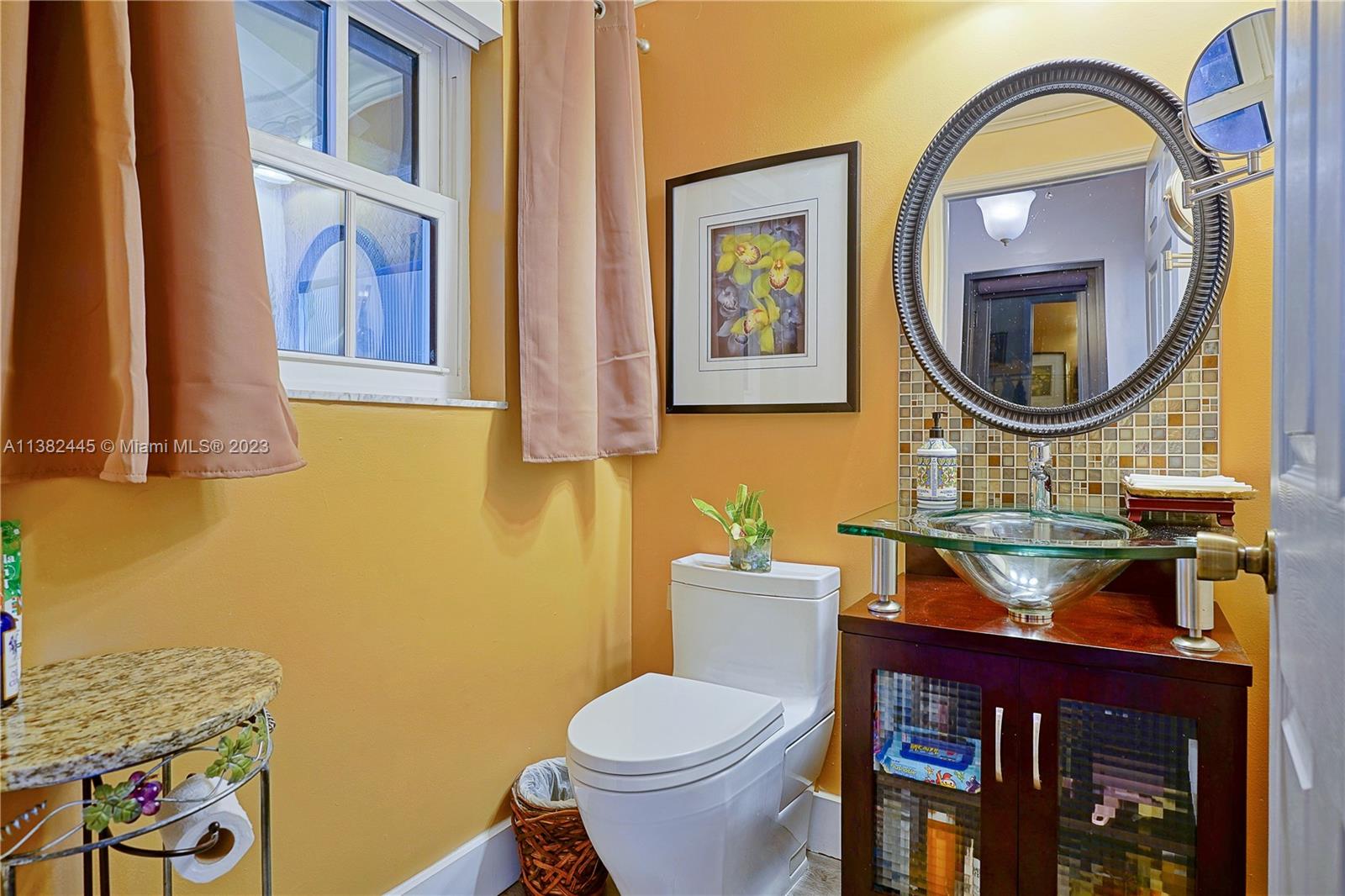 3078 Southwest 153rd Path, Unit 3078 Miami, FL 33185 - Photo 17 of 36 a bathroom with a toilet a sink and a mirror