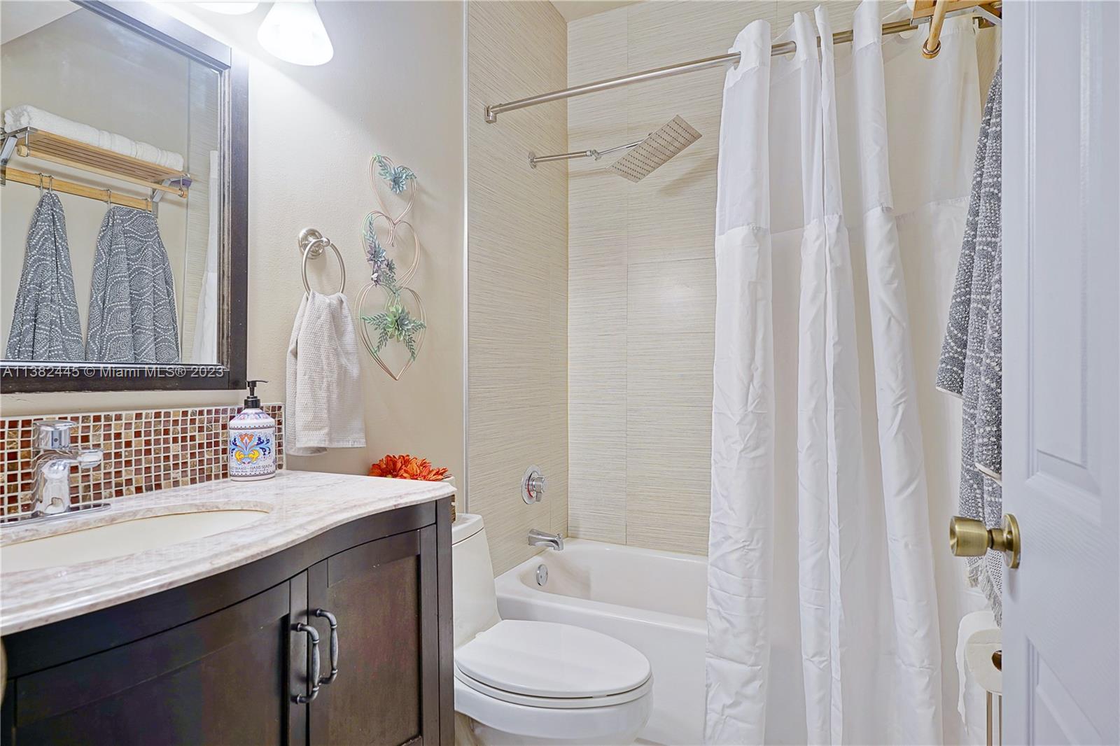3078 Southwest 153rd Path, Unit 3078 Miami, FL 33185 - Photo 25 of 36 a bathroom with a sink toilet and shower