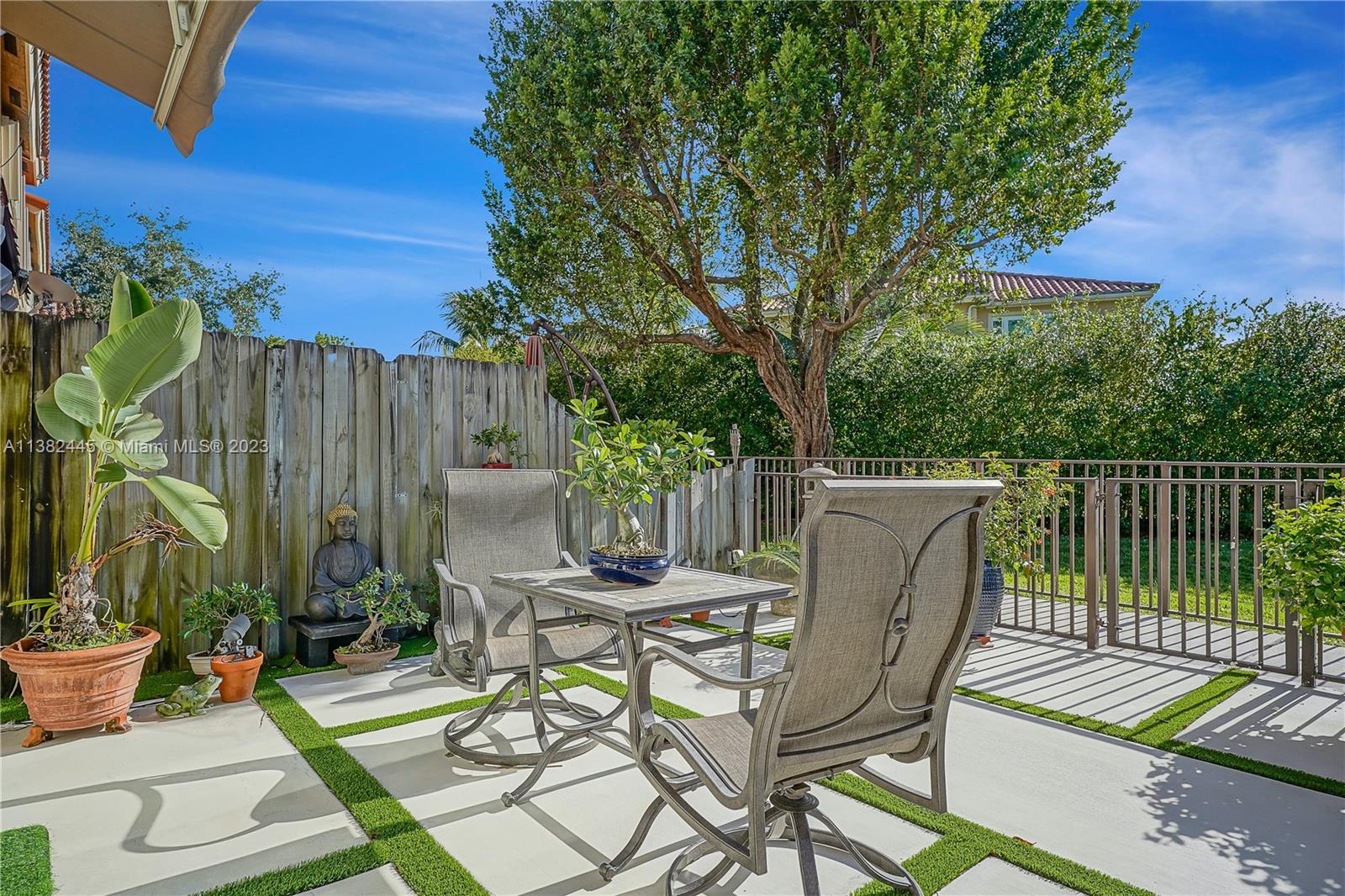 3078 Southwest 153rd Path, Unit 3078 Miami, FL 33185 - Photo 26 of 36 a view of a chairs and table in patio