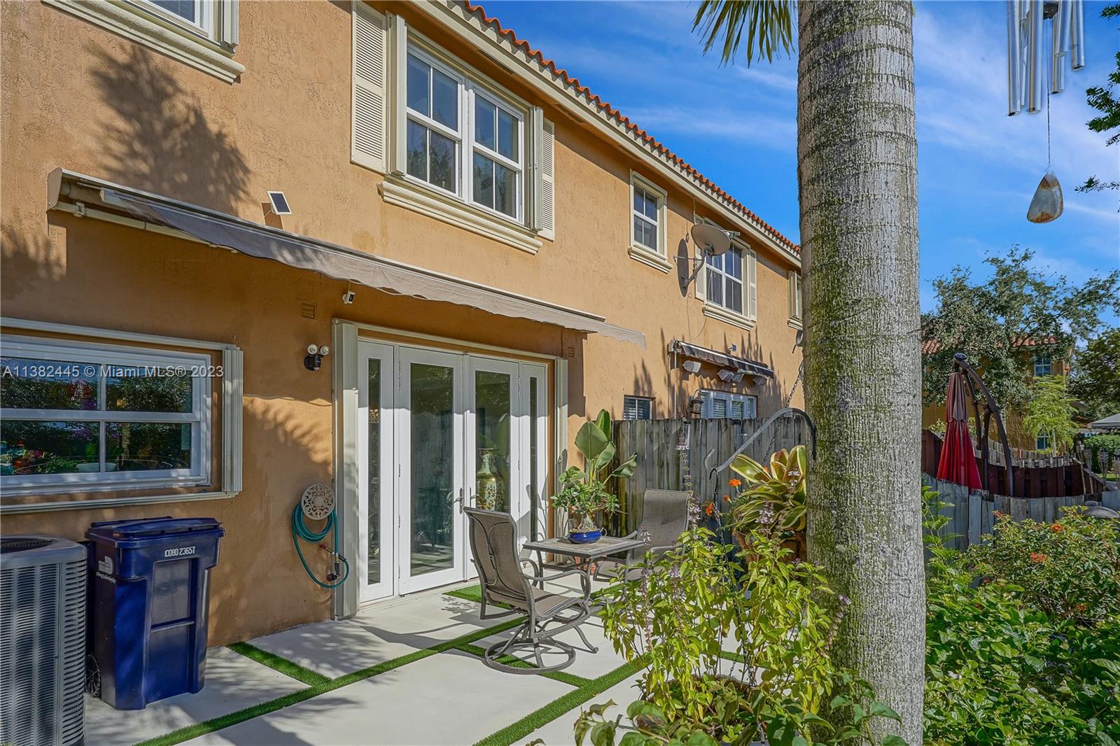 3078 Southwest 153rd Path, Unit 3078 Miami, FL 33185 - Photo 30 of 36 a front view of a house with a yard