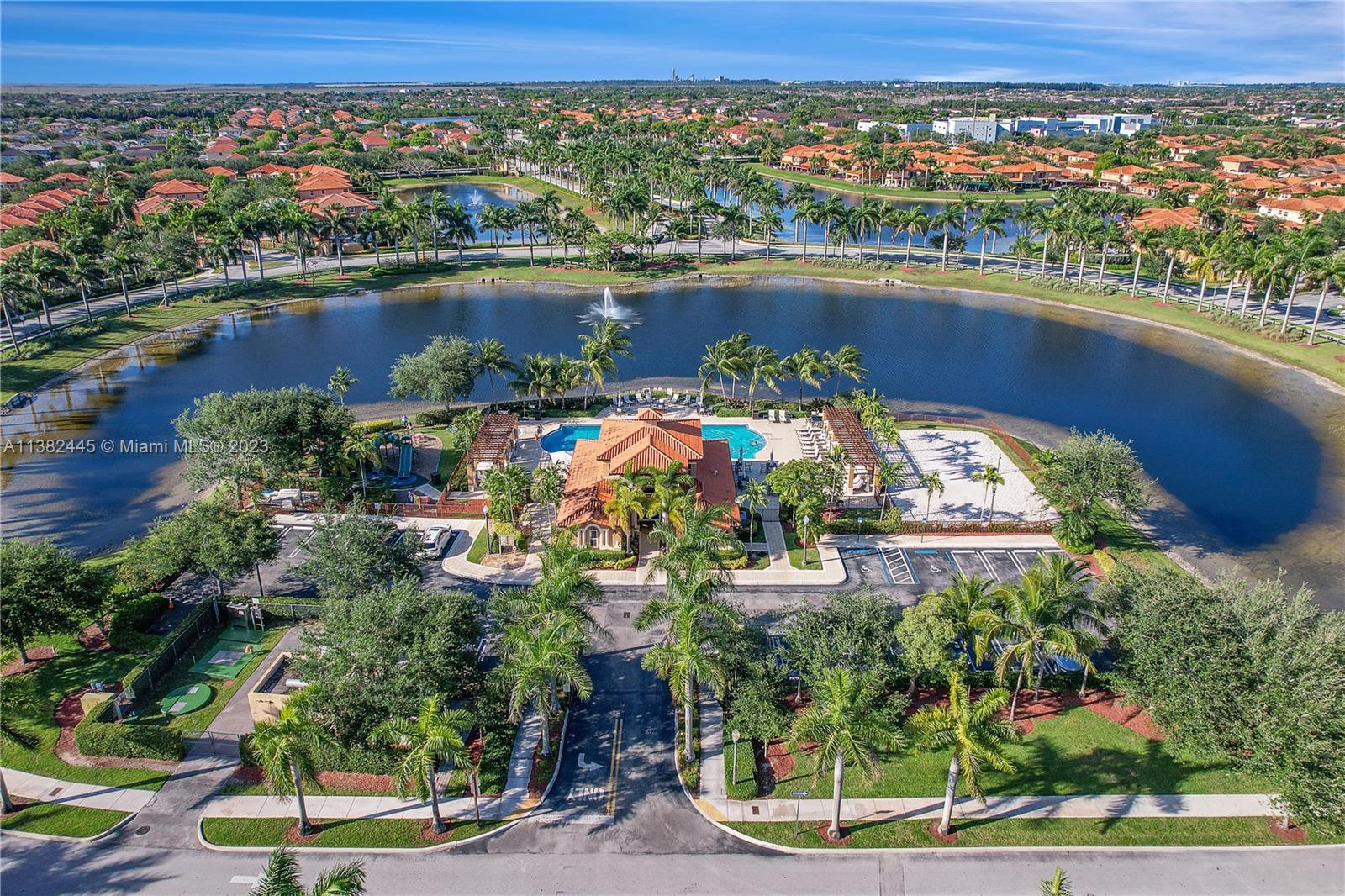 3078 Southwest 153rd Path, Unit 3078 Miami, FL 33185 - Photo 33 of 36 an aerial view of lake and residential houses with outdoor space