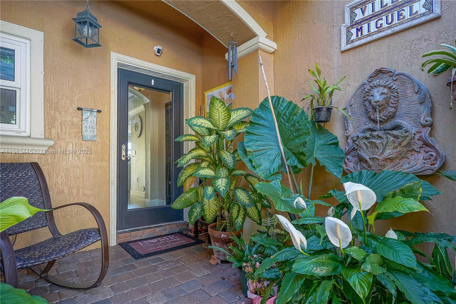 3078 Southwest 153rd Path, Unit 3078 Miami, FL 33185 - Photo 9 of 36 a potted plant sitting in front of a house