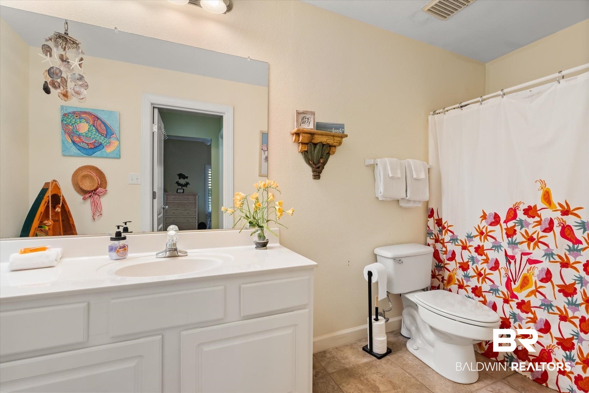 27770 Canal Road, Unit 2304 Orange Beach, AL 36561 - Photo 7 of 30 Full bathroom featuring toilet, visible vents, baseboards, vanity, and tile patterned floors