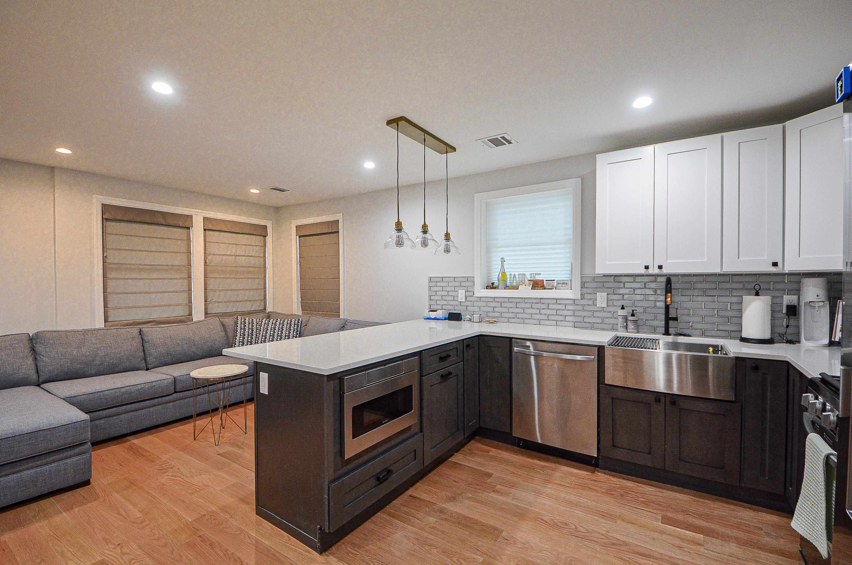 a kitchen with stainless steel appliances granite countertop stove top oven and cabinets
