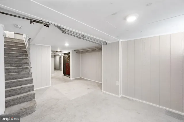 a view of an empty room with stairs