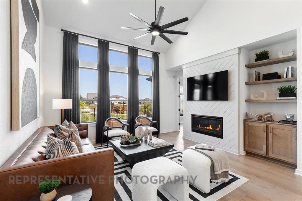 2132 Nerello Way Rockwall, TX 75032 - Photo 14 of 40 a living room with furniture fireplace and flat screen tv