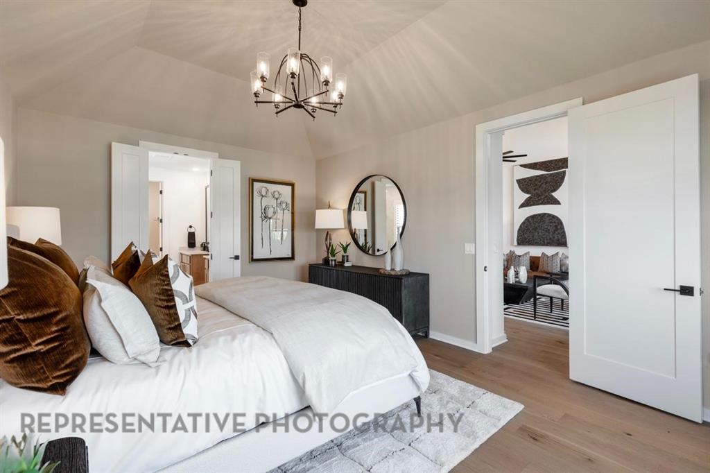 2132 Nerello Way Rockwall, TX 75032 - Photo 17 of 40 a bedroom with bed and wooden floor