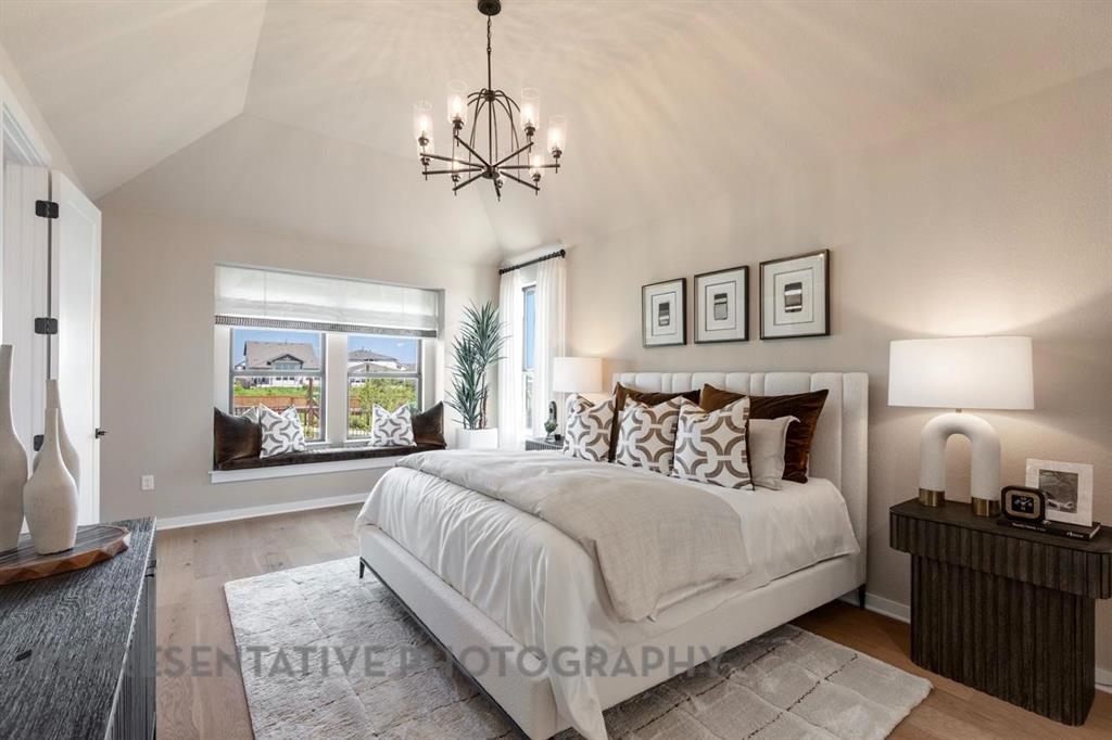 2132 Nerello Way Rockwall, TX 75032 - Photo 19 of 40 a bedroom with a large bed and a window