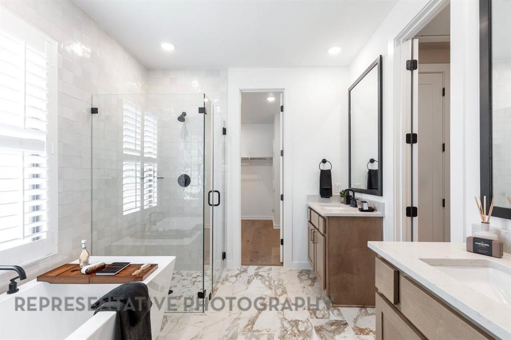 2132 Nerello Way Rockwall, TX 75032 - Photo 20 of 40 a spacious bathroom with a tub sink and mirror