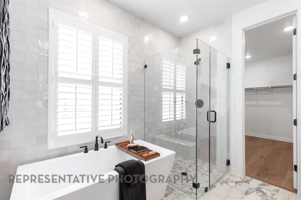 2132 Nerello Way Rockwall, TX 75032 - Photo 21 of 40 a bathroom with a sink and a shower