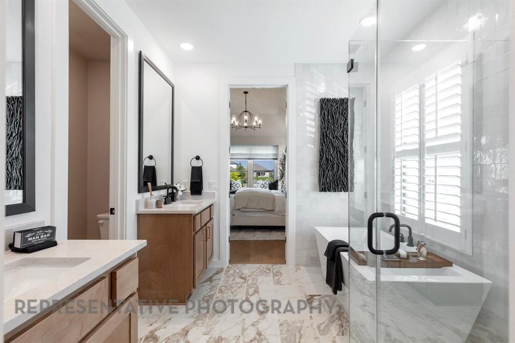 2132 Nerello Way Rockwall, TX 75032 - Photo 22 of 40 a kitchen with stainless steel appliances granite countertop a sink refrigerator and cabinets