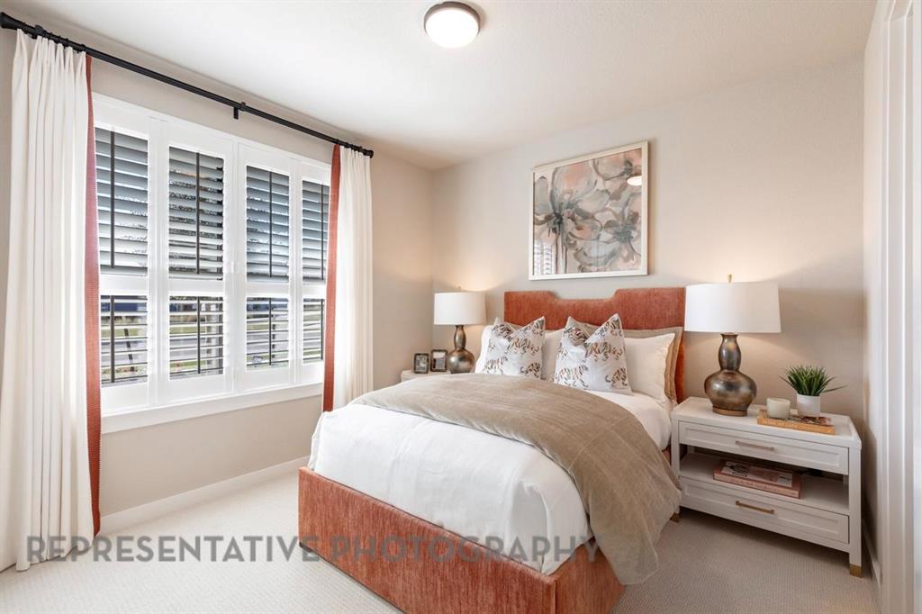 2132 Nerello Way Rockwall, TX 75032 - Photo 31 of 40 a spacious bedroom with a bed and a window